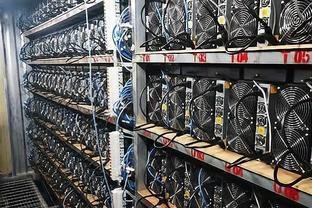 Aerial view of a large-scale Bitcoin mining farm with rows of operating miners.